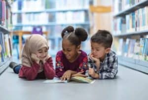 Kids reading at a Pioneer Valley library